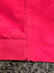9745, a photo showing the topstitched hemline on how to fix a ripped hem